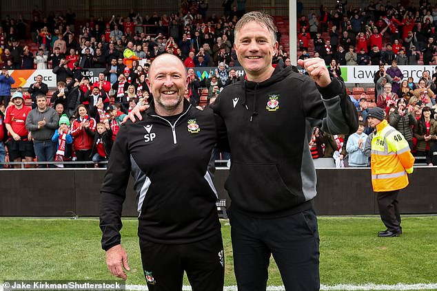 Wrexham manager Phil Parkinson (right) praised his side, adding he was 'immensely proud'