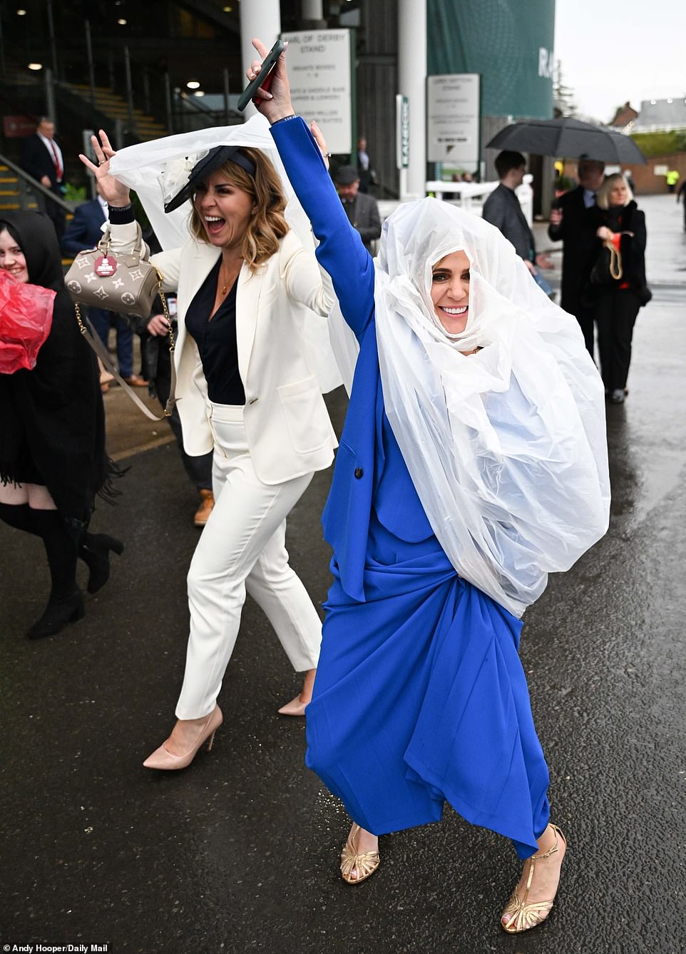 Aintree is all about fashion, but when it rains, style sometimes has to take a backseat to staying dry!