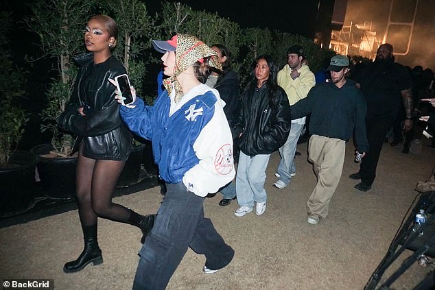 Justine (left) looked stunning in the ensemble she wore on stage, which consisted of a leather ensemble with dramatic blue eyeshadow