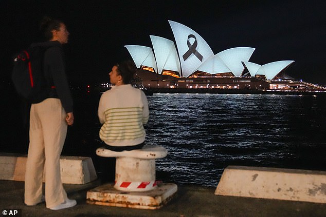 The black ribbon is a symbol of remembrance or mourning and is displayed as a public symbol of comfort