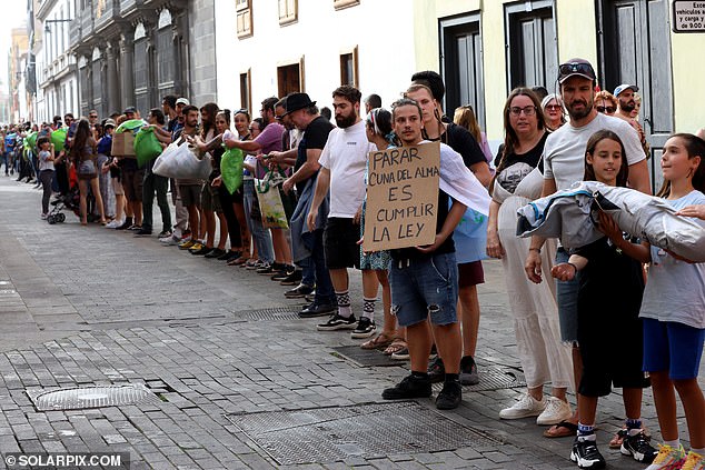 Anti-tourism protesters line the streets