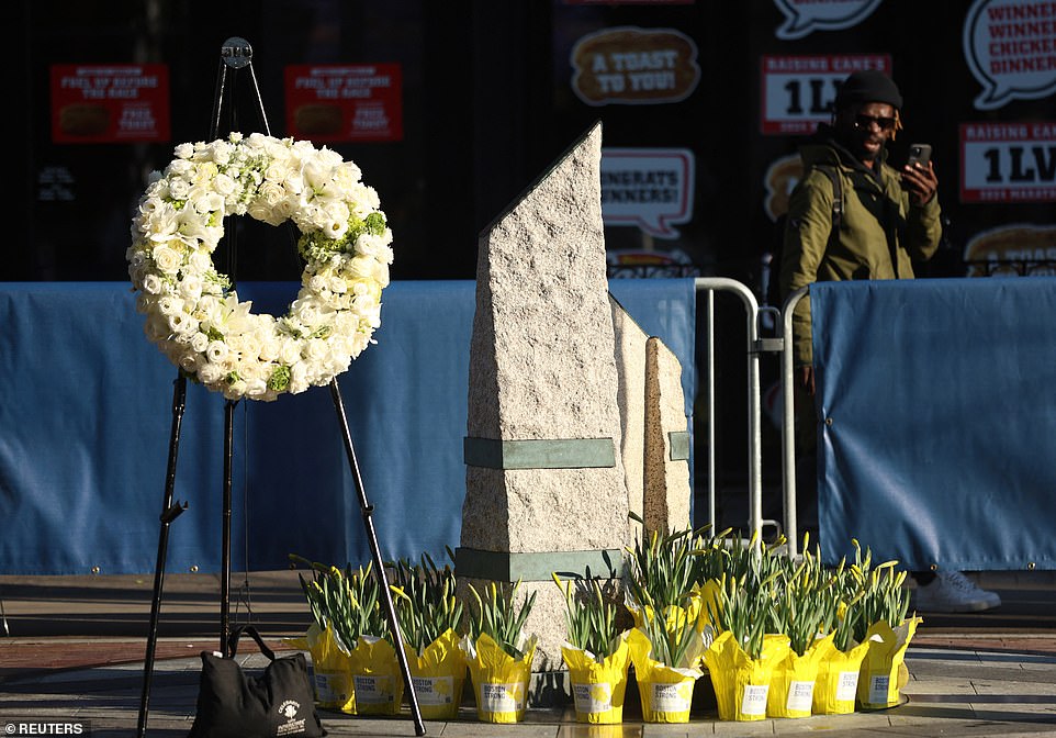 General view: A wreath and flowers are seen at a memorial on Boylston Street on the eleventh anniversary of the attack