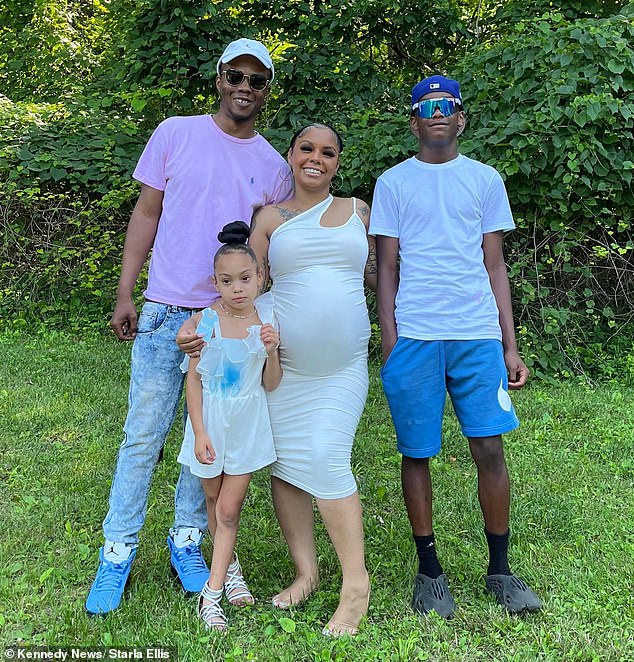 Mrs. Ellis with her family while pregnant with her third child