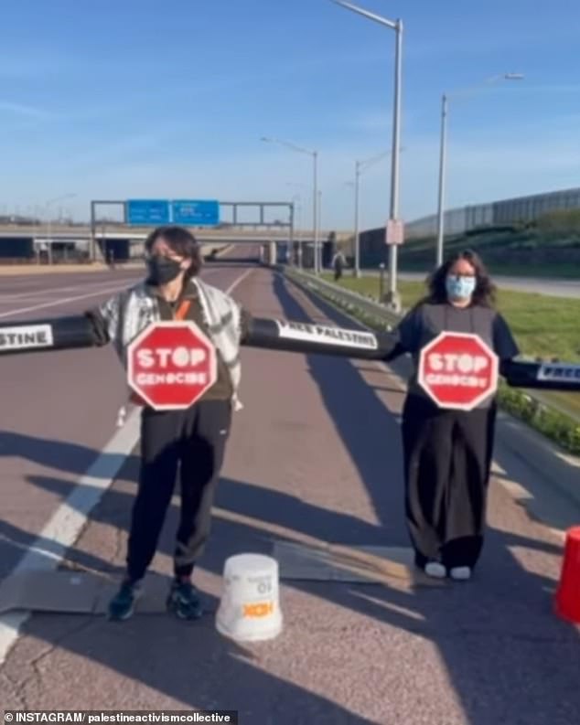 Around 8:23 a.m. Monday, protesters sat in the middle of the Kennedy Expressway, connected by PVC pipes.  They are seen with stop signs around their necks that read 'Stop Genocide'