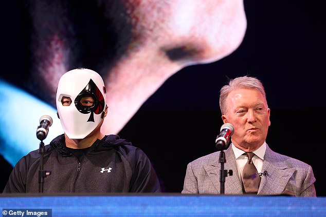 The heavyweight contenders arrived at the press conference wearing masks before the matchups were revealed