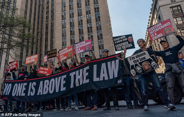 Anti-Trump demonstrators gather outside the courthouse in New York City on Monday to protest the former president and defend the lawsuits against him