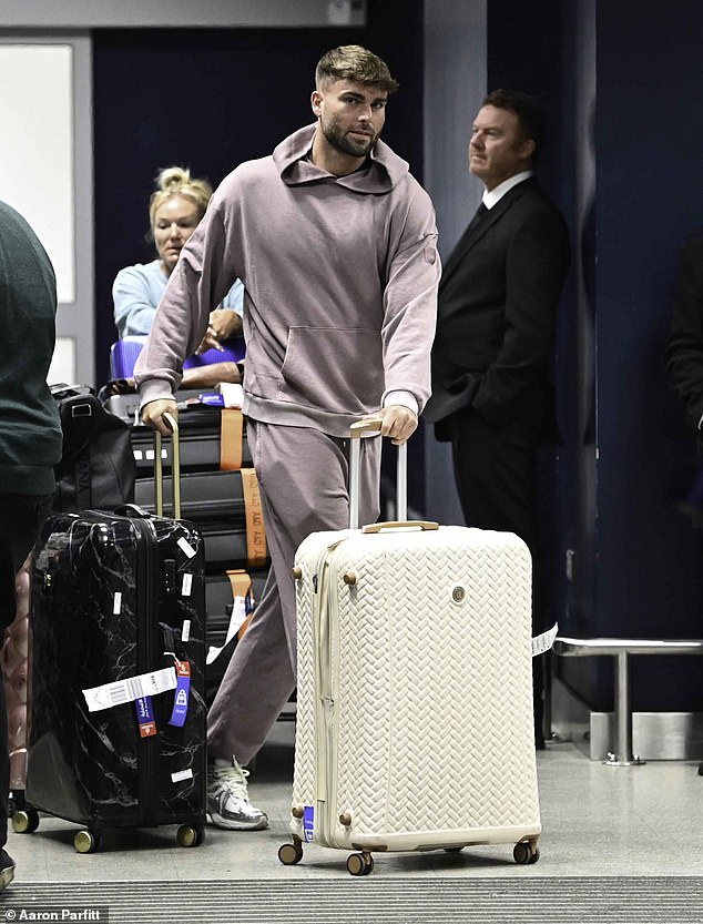 Meanwhile, Tom, 24, cut a casual figure in a purple Alo tracksuit and trainers as he pushed suitcases out of the airport terminal