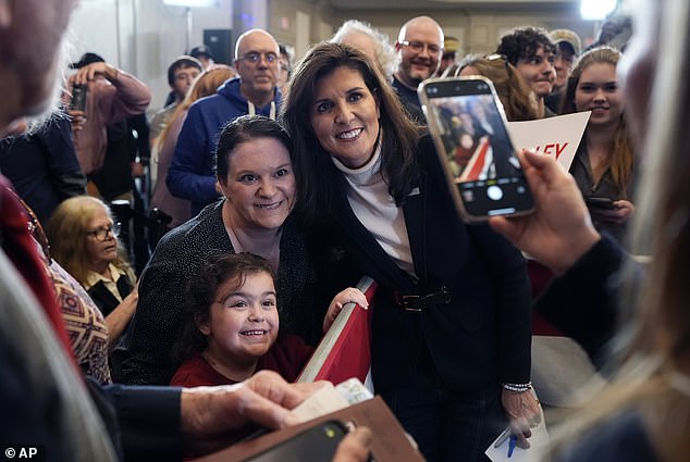 Nikki Haley poses with supporters on March 3 in South Burlington, Vermont.  Haley won Vermont and Washington DC, but lost all other Republican primaries to former President Donald Trump and dropped out of the presidential race early last month