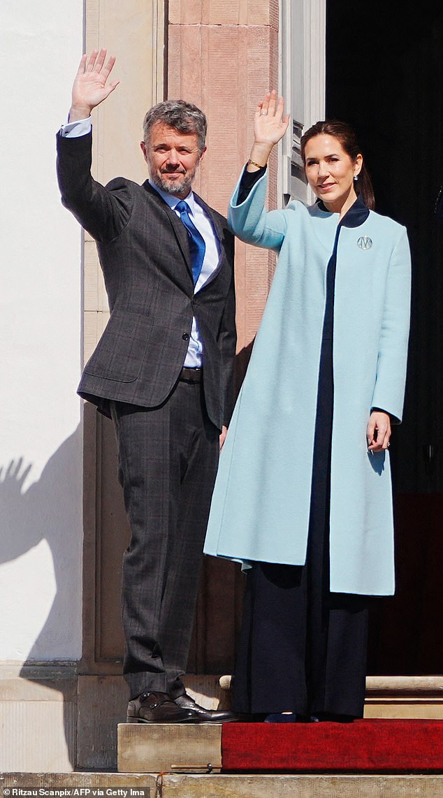 The couple, pictured outside the royal residence on the occasion of Margrethe's birthday, chose to show sartorial solidarity by wearing blue, amid rumors of marital troubles in recent months.