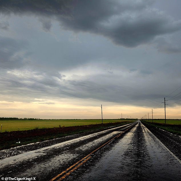 Scattered thunderstorms are likely Tuesday evening from Chicago all the way to eastern Dallas after storm chasers captured images of the fast-moving storm system early in the day in the Texas Big County, pictured, a two-lane tarmac after the storm on Tuesday morning