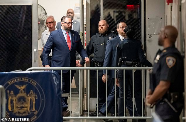 Trump aide Jason Miller is seen at the courthouse.  He sat at the back of the court