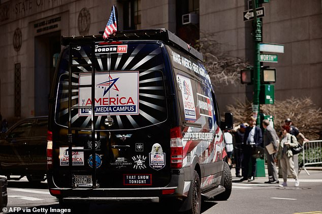 A Trump supporter drives a van outside the Manhattan Criminal Court on Tuesday