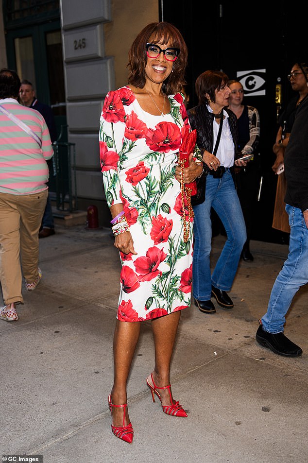 Gayle King, 69, was also spotted in a mood-boosting bright red look ahead of the show.  The television personality modeled a white midi dress with quarter sleeves covered in red poppies and green leaves.  She paired the statement dress with a T-strap, red sandal heels, a matching leather bag and ombré-style glasses.