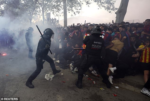 Police intervened and used batons after objects were thrown at the Barcelona team bus