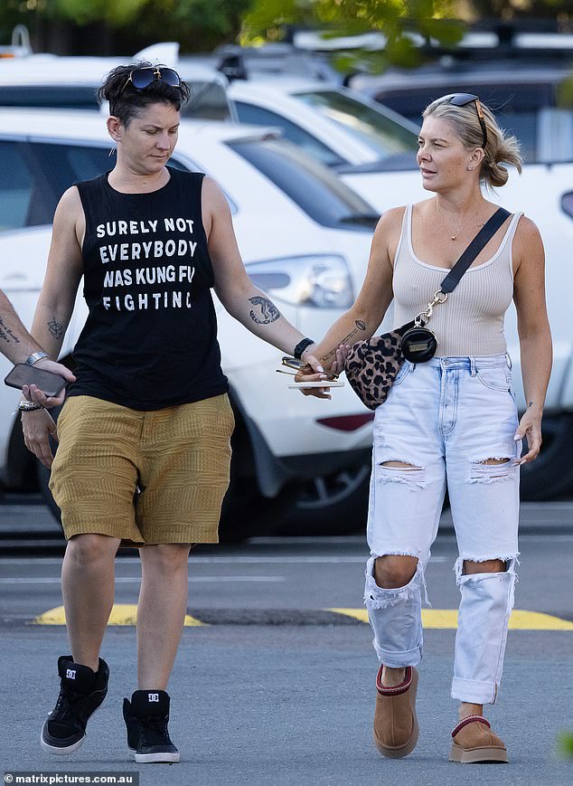 They added mustard shorts, black high-top sneakers and several bracelets, while adding sunglasses to their heads