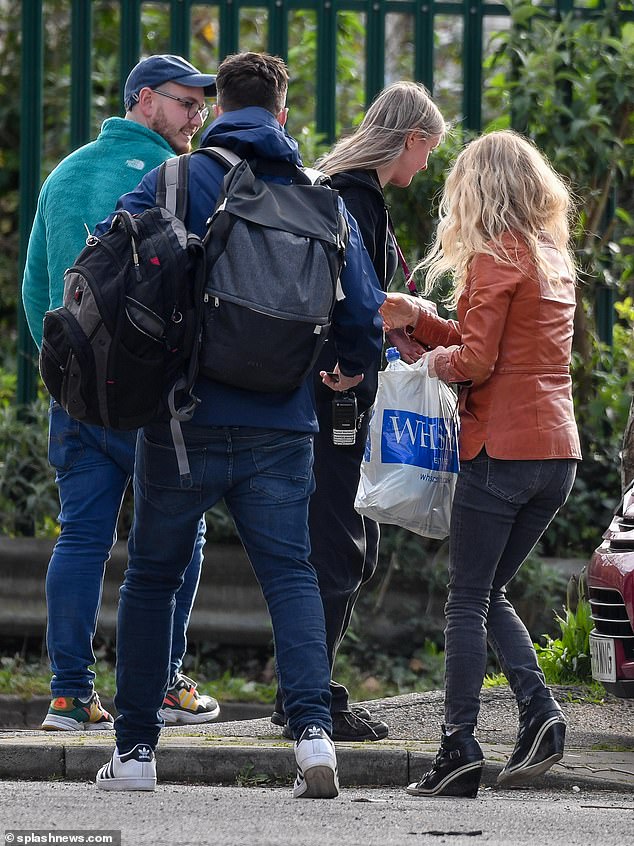 Lucy was accompanied by a group, including an employee wearing a lanyard and radio