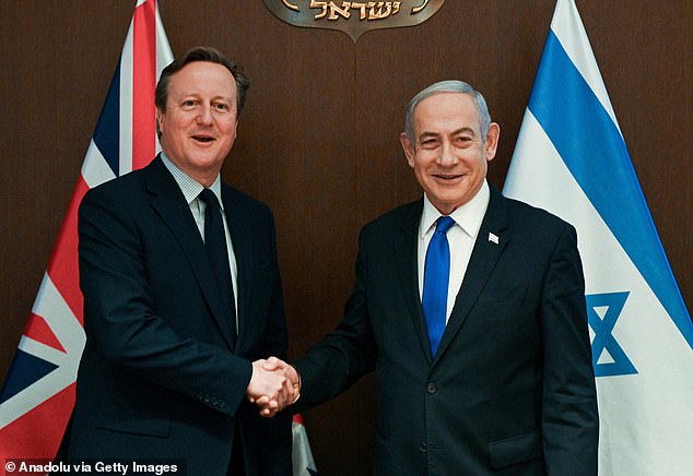 Israeli Prime Minister Benjamin Netanyahu (right) welcomes British Foreign Secretary David Cameron (left) during his official visit to West Jerusalem