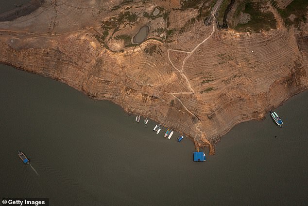 Aerial view of the El Guavio Reservoir dock, one of the water sources for the Colombian capital Bogotá, where the water level has visibly dropped due to a drought that lasted several months due to the El Niño weather pattern