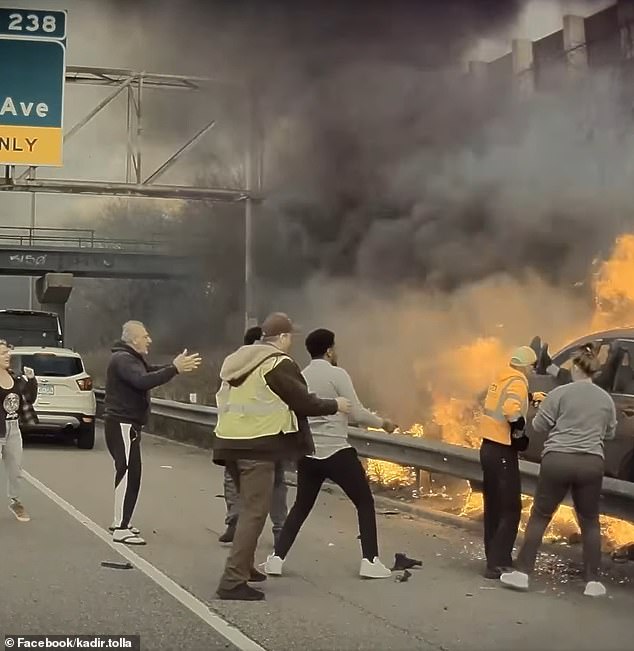 A Minnesota Department of Transportation officer arrived and smashed the window, allowing Good Samaritans to get the driver to safety