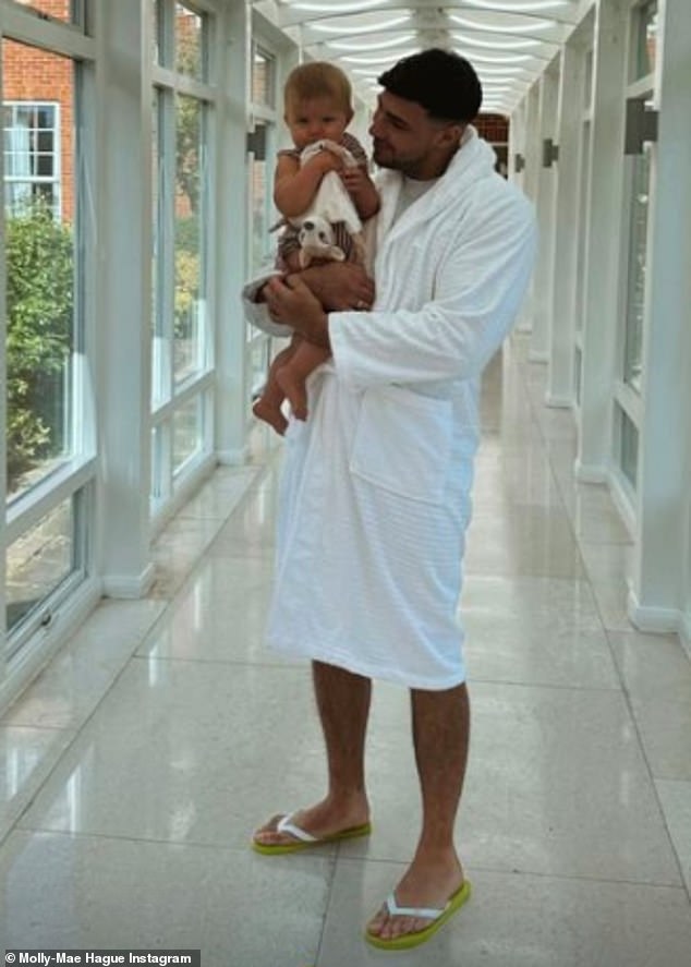 Elsewhere, she shared a sweet photo of boxer Tommy, 24, in a fluffy white robe as he held little Bambi