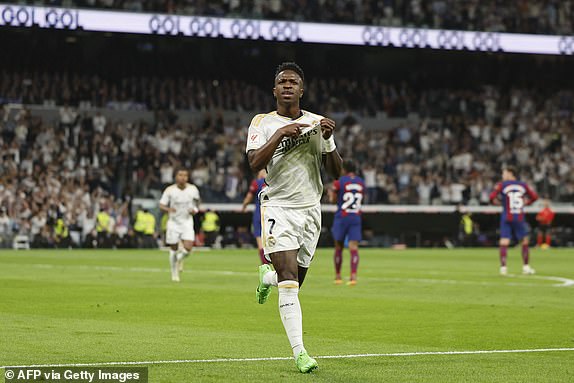 Brazilian forward #07 Vinicius Junior of Real Madrid celebrates his goal from the penalty spot during the Spanish football match between Real Madrid CF and FC Barcelona at Santiago Bernabeu Stadium in Madrid on April 21, 2024. (Photo by OSCAR DEL POZO / AFP) ( Photo by OSCAR DEL POZO/AFP via Getty Images)