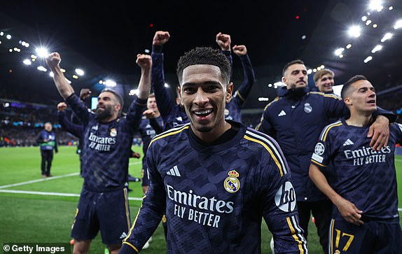 MANCHESTER, ENGLAND - APRIL 17: Jude Bellingham of Real Madrid celebrates with teammates after the UEFA Champions League quarter-final second leg match between Manchester City and Real Madrid CF at the Etihad Stadium on April 17, 2024 in Manchester, England.  (Photo by Alex Livesey - Danehouse/Getty Images)