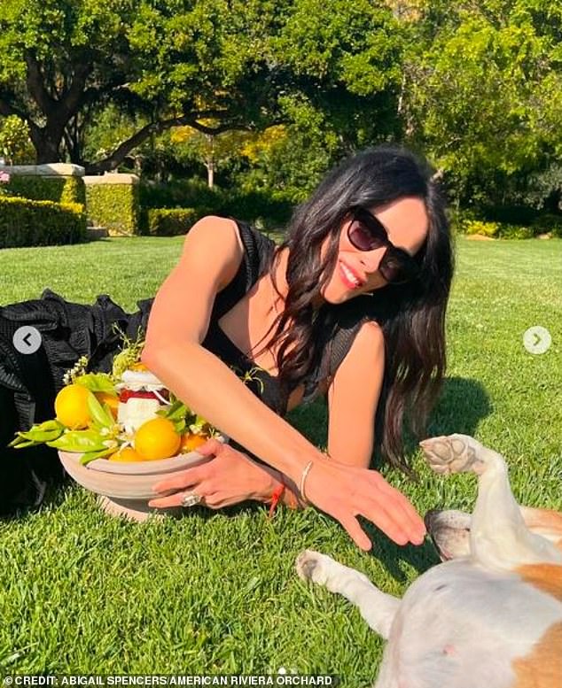 Smiling in a sunny garden with her dog, the Grey's Anatomy star showed off the ceramic bowl for all to see