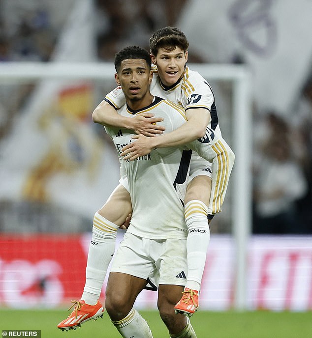 Bellingham celebrates with Brahim Diaz after the referee's whistle