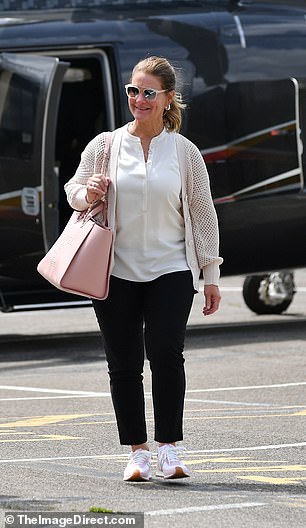 Melinda seemed in good spirits as she stepped out of a helicopter this weekend