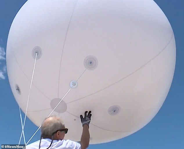 About 15 other community members joined the resident as he launched the balloon