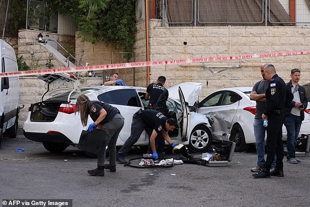 Israeli police investigated the scene of the attack after the suspected 'terrorists' fled on foot