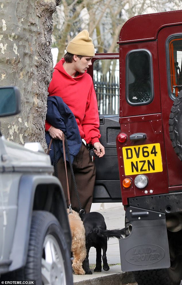 After Saturday night's party, Cruz was spotted in London taking his beloved dogs for a walk while rocking casual attire.