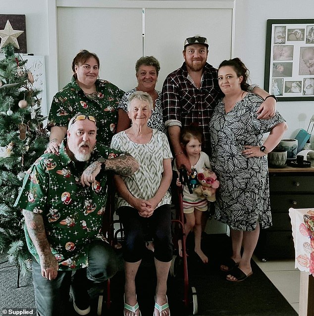 Pictured: The Figg family last Christmas - Robyn's daughter Daisy and her partner Ian (far left), Mrs Figg (centre back) and her mother Betty (centre front), son Josh, his wife Liz, their daughter Grace (right)