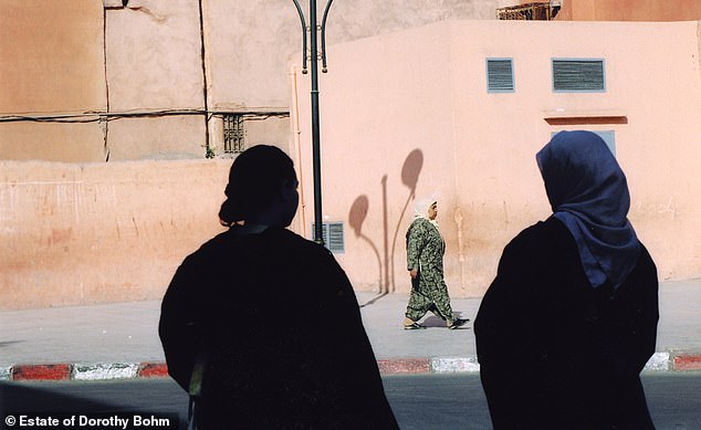 Bohm continued to take photographs throughout Europe in later life.  Above: Locals on a street in Marrakech, Morocco, in 2004