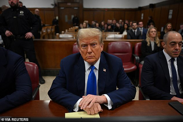 Former US President and Republican presidential candidate Donald Trump takes a seat in Manhattan Criminal Court during his trial for allegedly covering up hush money payments related to extramarital affairs in New York, US, April 22, 2024.