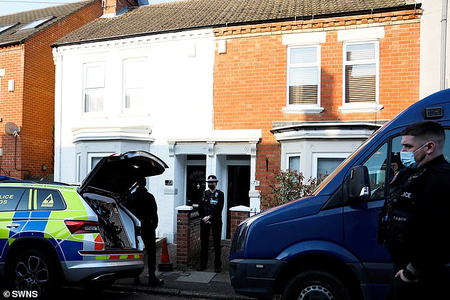 Officers outside the couple's home in Kingsley, Northamptonshire in April 2023