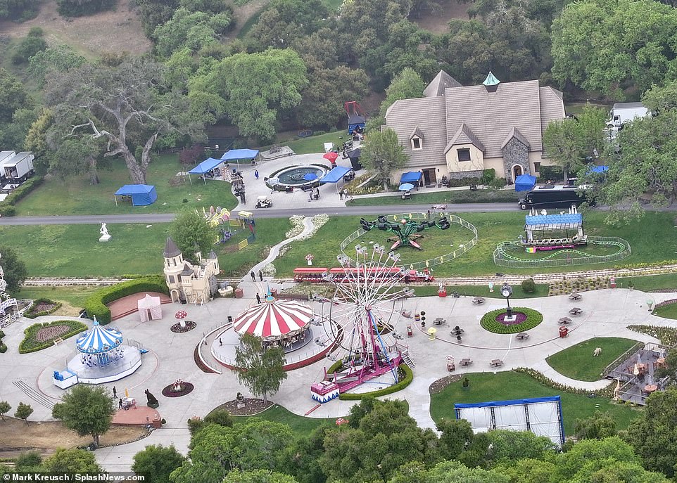 Ariel photos show that the carnival rides, tents and children's trains that Neverland became famous for have all been painstakingly rebuilt, along with a Ferris wheel and a replica of Jackson's carousel