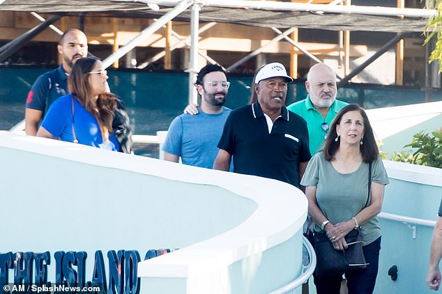 Sydney and her father were joined by real estate agent brother Justin at the waterfront seafood restaurant Tierra Verde.  The siblings can be seen at the back of the group