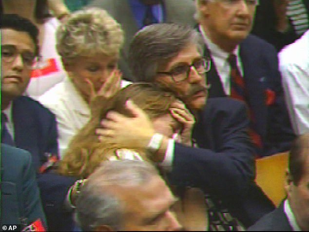 Ronald Goldman's father Fred hugged his daughter Kim as the verdicts were read.  Fred said in a statement earlier this month that Simpson's death was 