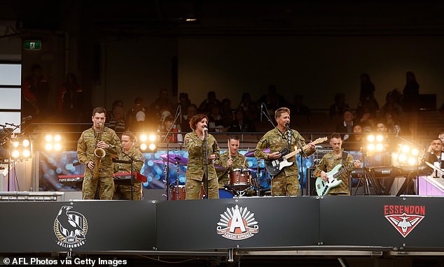 The Anzac Day match has been enhanced with live music and a festive atmosphere at the MCG