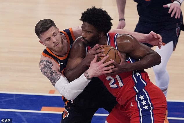 New York Knicks' Isaiah Hartenstein defends Philadelphia 76ers' Joel Embiid in second half