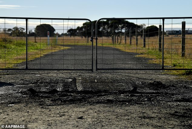 State Coroner John Cain found that Mrs Thomas deliberately took her life and the lives of her two children in an act of domestic violence (pictured, fire aftermath)