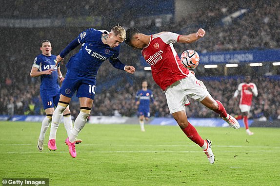 LONDON, ENGLAND – OCTOBER 21: Chelsea's Mykhaylo Mudryk clashes with Arsenal's William Saliba during the Premier League match between Chelsea FC and Arsenal FC at Stamford Bridge on October 21, 2023 in London, England.  (Photo by Michael Regan/Getty Images)