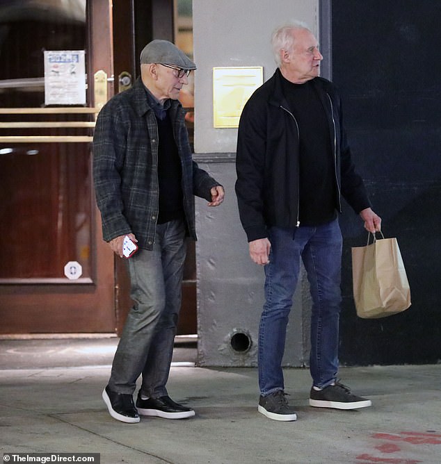 Patrick wore a gray flat cap with a dark checked shirt and gray jeans, while Brent opted for a black jacket over a matching sweater and blue jeans