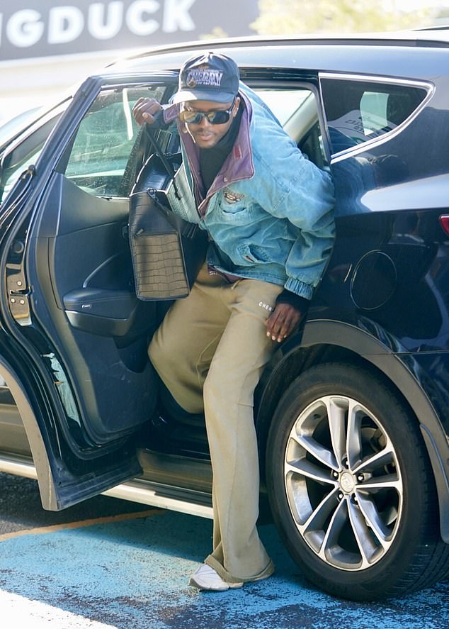 The 35-year-old fashionista turned the terminal into his catwalk, wearing a patch-adorned vintage denim jacket