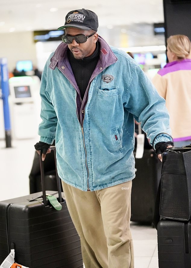 Under the brim of his trendy cap and behind sleek sunglasses, Vas' travel-ready outfit was completed with a practical yet chic black handbag