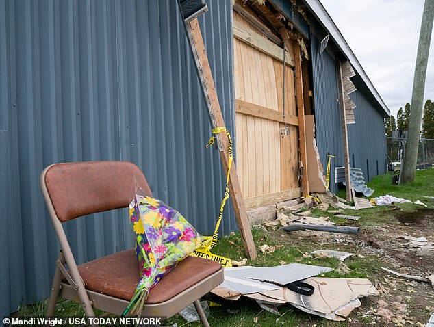 Flowers were left on Sunday at the spot where the driver smashed through a wall at the Swan Boat Club during a children's birthday party the day before