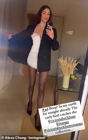 She paired the skimpy co-set with a smart black blazer, sheer tights and stilettos to boost her height