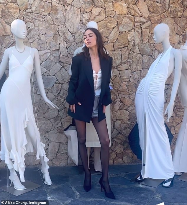 After arriving at the event, she posed next to some mannequins with some pieces from the collection that went live on Tuesday