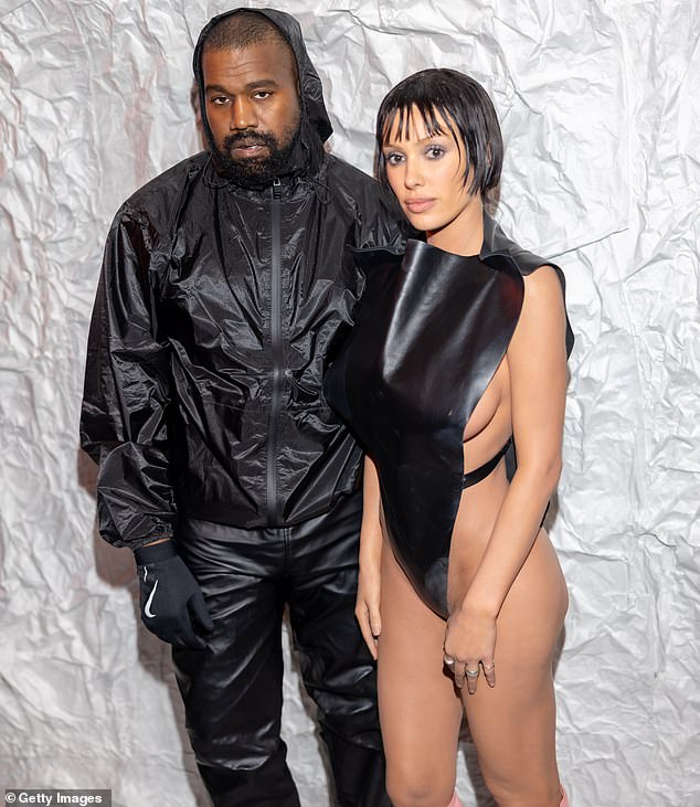 Kanye is pictured with his wife Bianca Censori at Milan Fashion Week in February